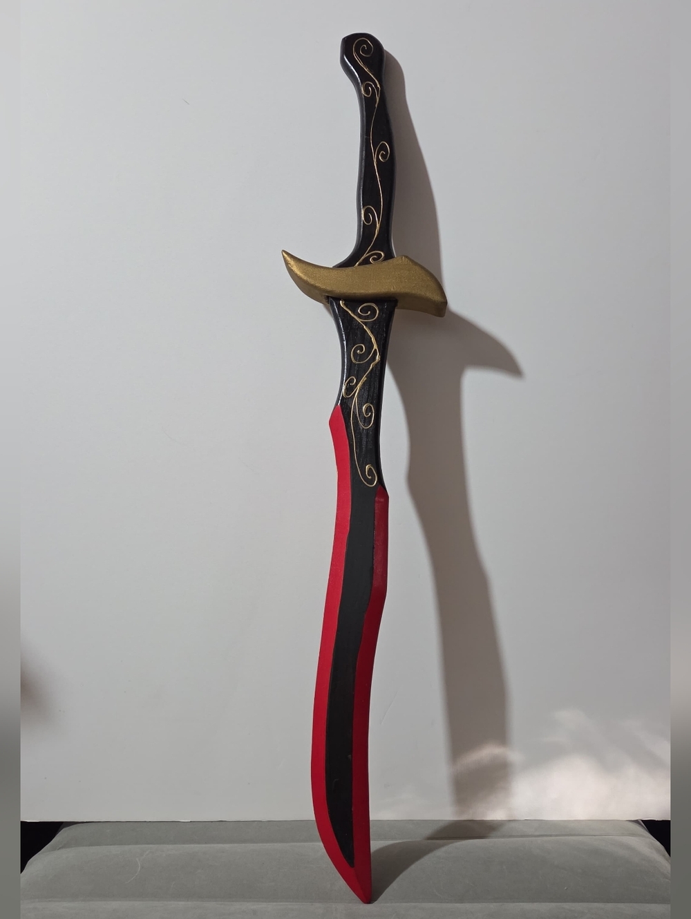 hand-painted blunt-tipped wooden replica sword